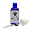 Active CBD Oil 1250mg tincture in blue bottle with dropper, ideal for boosting wellness.